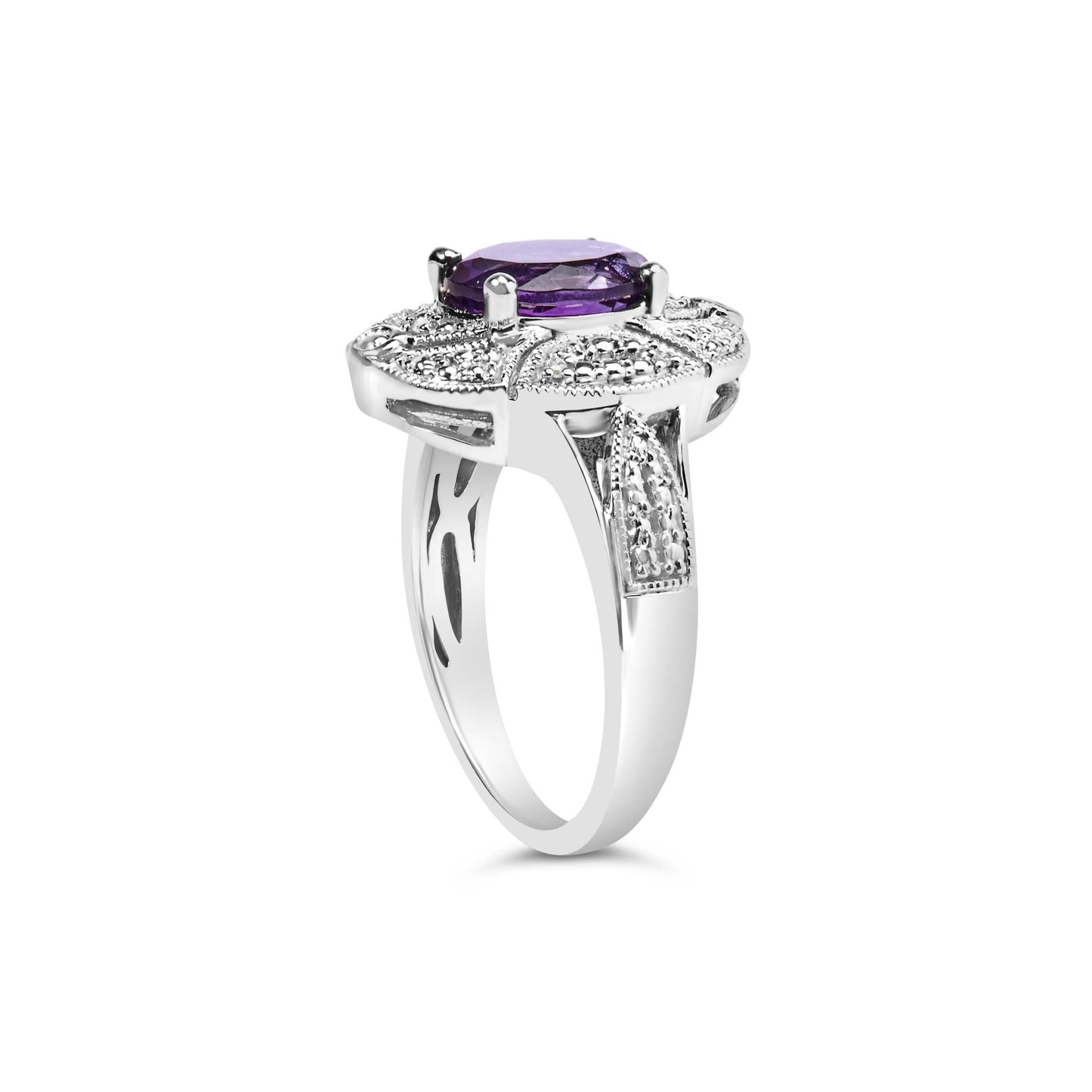 Side angle view of a white ring with an oval purple gemstone in a four-prong setting, surrounded by round white gemstones in prong settings on the band.