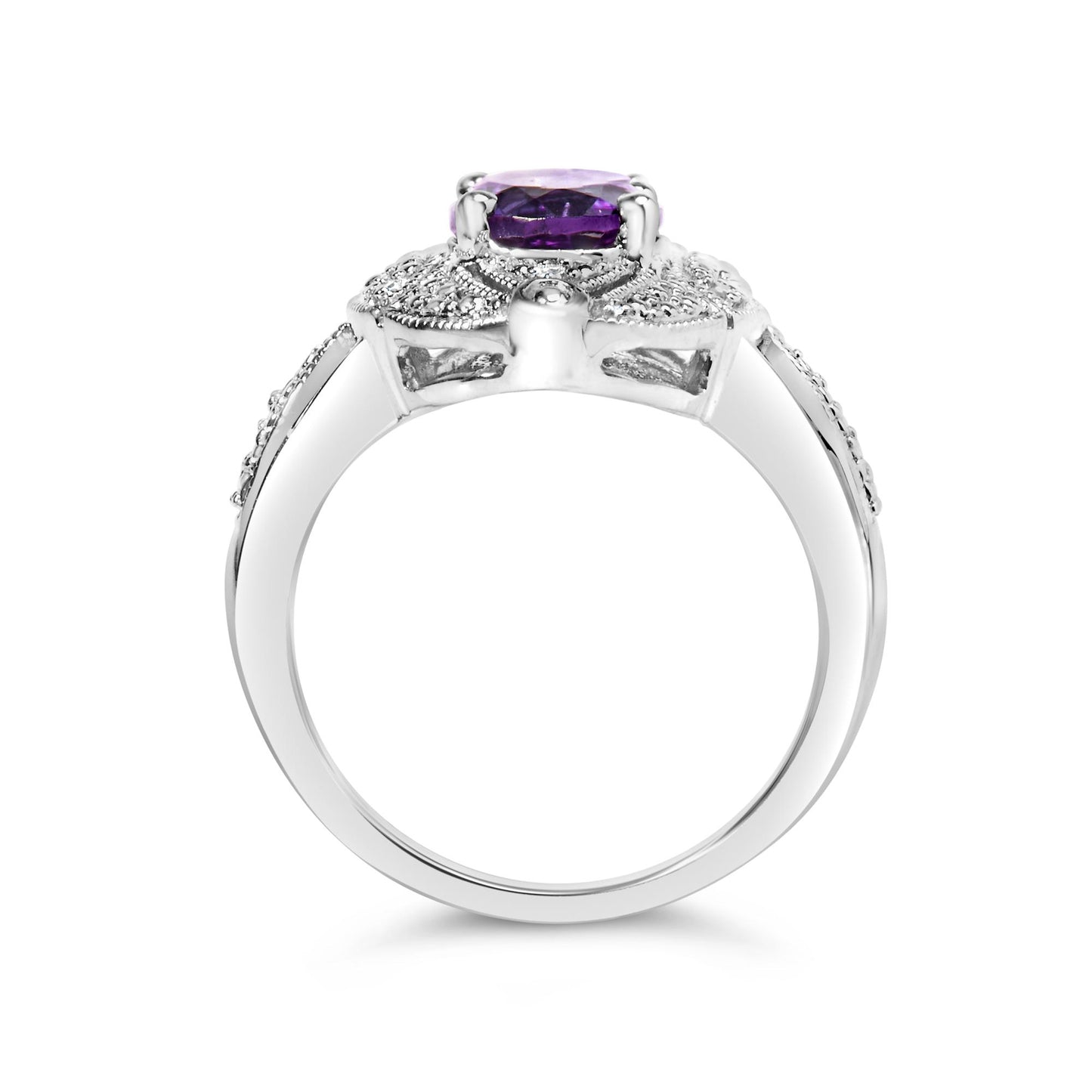 Close-up side view of a white metal ring featuring an oval purple gemstone in a four-prong setting, surrounded by six round white gemstones in prong settings along the band.