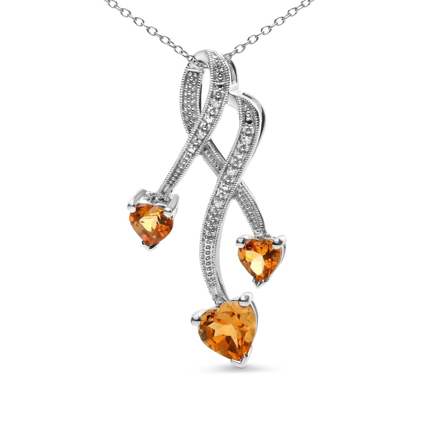 Close-up front angle of a white metal necklace pendant with three heart-shaped yellow gemstones and multiple small round white gemstones in prong settings forming intertwined curved lines.