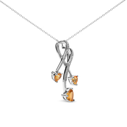 White metal necklace with a pendant view from a slight angle, featuring intertwined loops set with small white round gemstones and three yellow heart-shaped gemstones in prong settings.