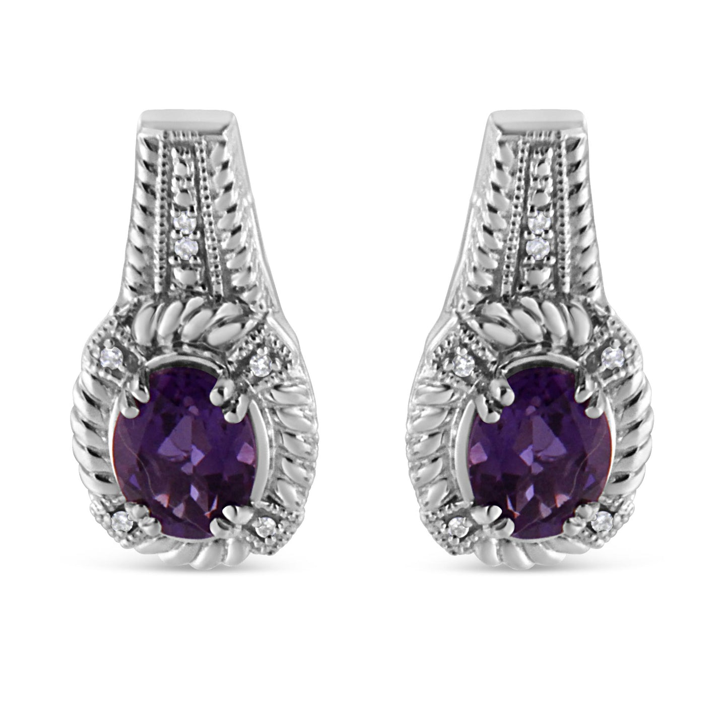Front-facing view of white metal earrings featuring oval purple gemstones surrounded by pave set round white gemstones.