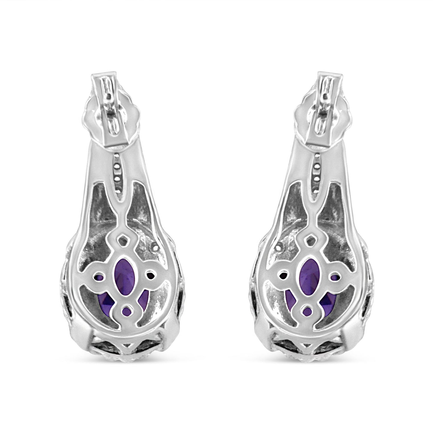Pair of white metal earrings shown from the back, featuring oval purple gemstones visible through decorative openwork, with small round white gemstones in pave setting.