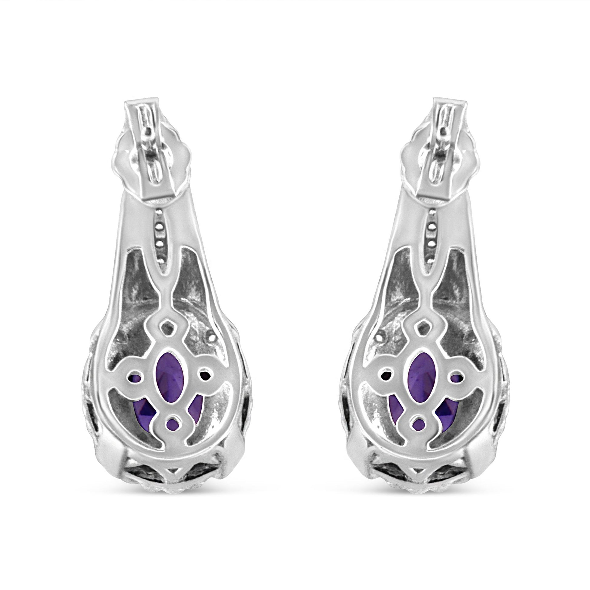 Pair of white metal earrings shown from the back, featuring oval purple gemstones visible through decorative openwork, with small round white gemstones in pave setting.
