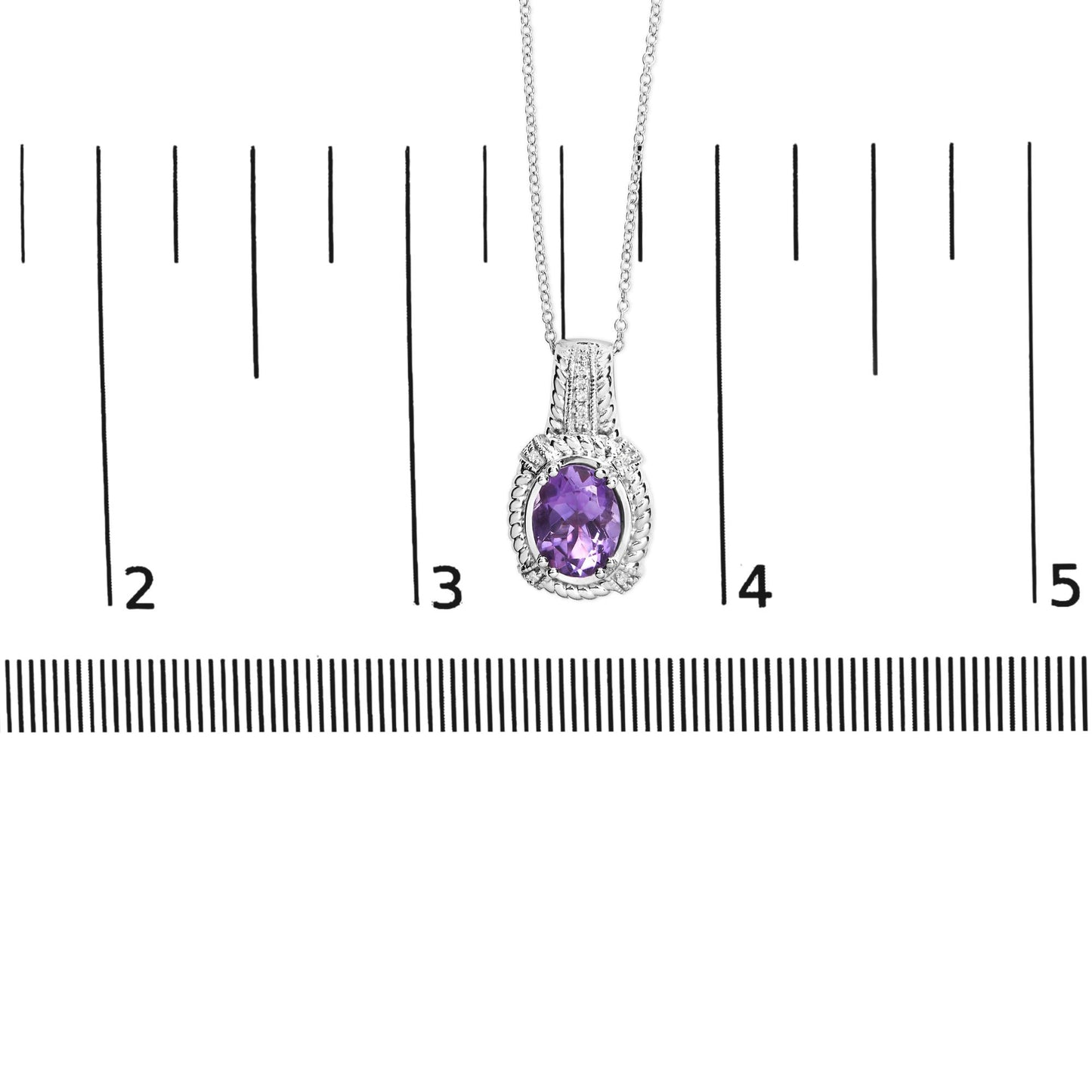 Close-up front view of a white metal necklace with an oval-shaped purple gemstone pendant, accented with small round white gemstones, displayed on a ruler for size reference.