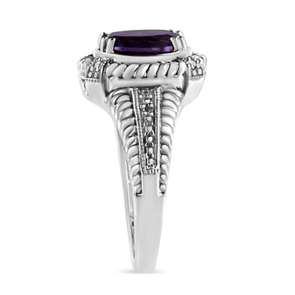 Front angle view of a white metal ring featuring an oval purple gemstone in prong setting, surrounded by round white gemstones in pave setting along detailed rope and textured band.
