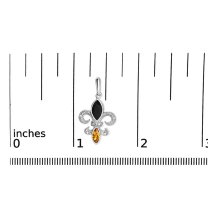 White metal earring with round white gemstones in prong setting and marquise-shaped black and yellow gemstones in bezel setting, shown on a ruler for size reference, front angle.