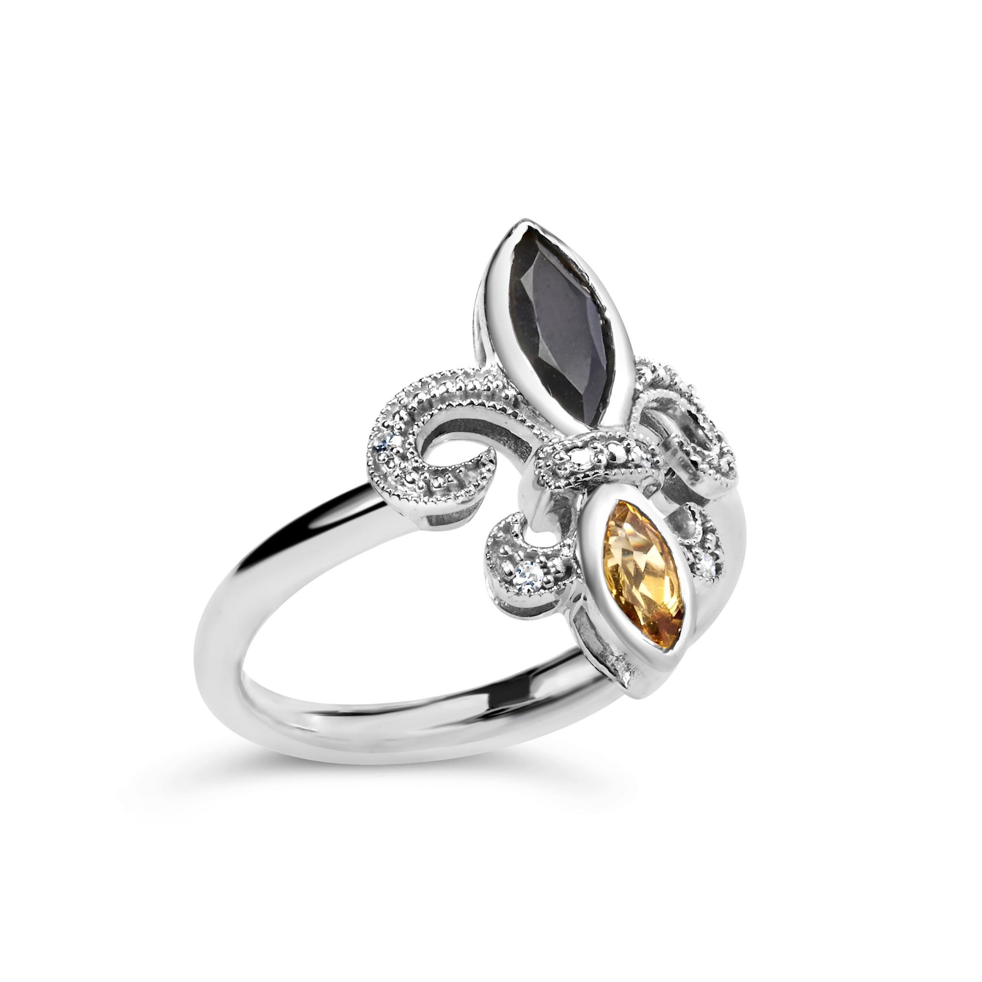 White metal ring with a fleur-de-lis design viewed at an angle, featuring a marquise-shaped black gemstone, a marquise-shaped orange gemstone in bezel setting, and small white round gemstones in pave setting.