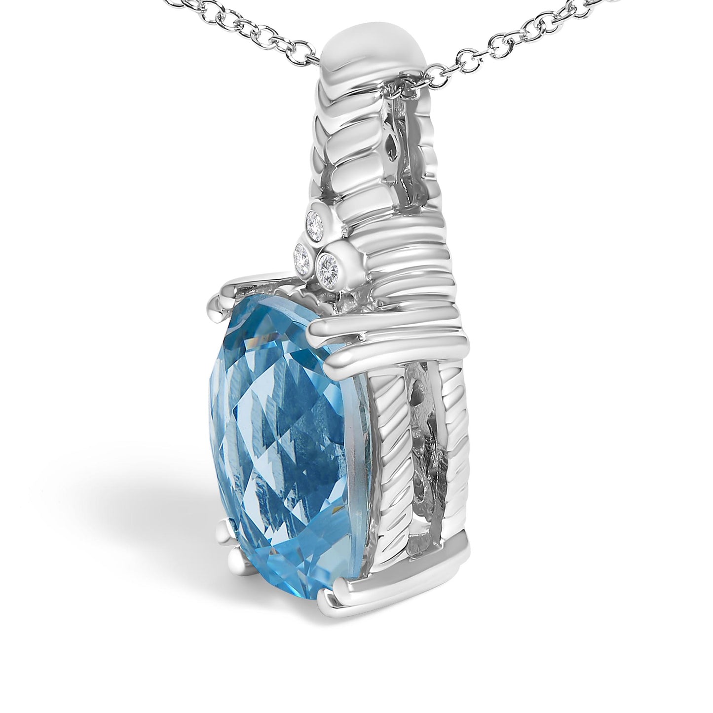 Close-up angled view of a white metal necklace pendant featuring a large blue cushion-shaped gemstone in prong setting, accented by three small round white gemstones in bezel settings atop the pendant.