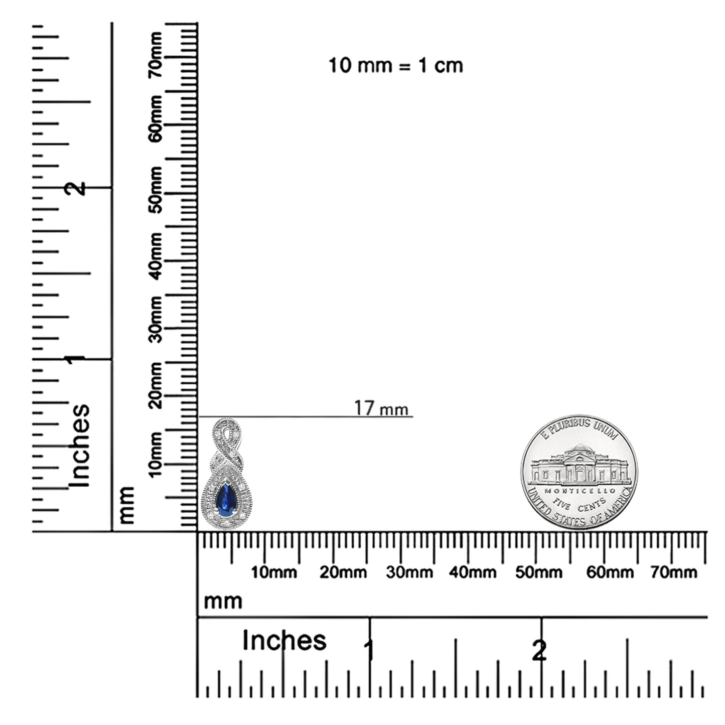 Close-up front angle of white metal earrings with pear-shaped blue gemstones surrounded by multiple round white gemstones, shown on a ruler for size reference.