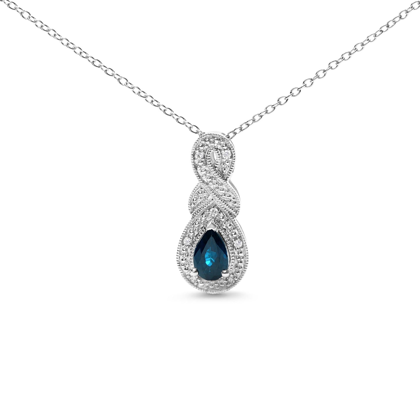 Front view of a white necklace with an infinity-shaped pendant featuring small round white gemstones and a pear-shaped blue gemstone at the bottom center.