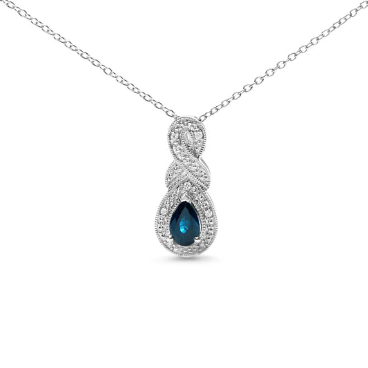 Front view of a white necklace with an infinity-shaped pendant featuring small round white gemstones and a pear-shaped blue gemstone at the bottom center.