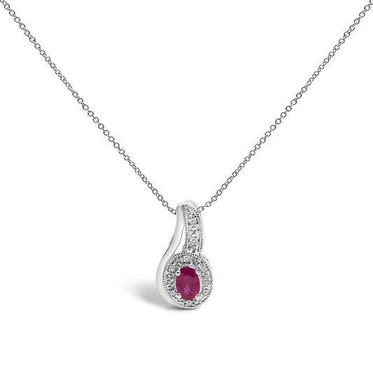 White necklace with a pendant featuring a red oval gemstone surrounded by small white round gemstones in a pave setting, shown in a front angle on a white background.