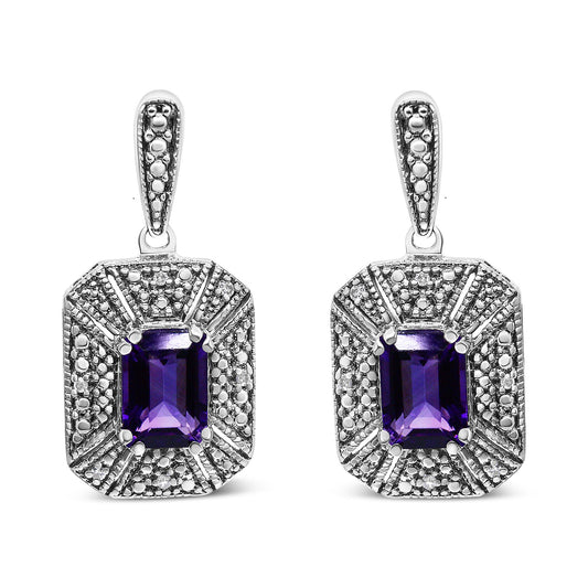 Pair of white metal earrings with rectangular purple gemstones in the center, surrounded by multiple small round white gemstones, shown from the front angle.