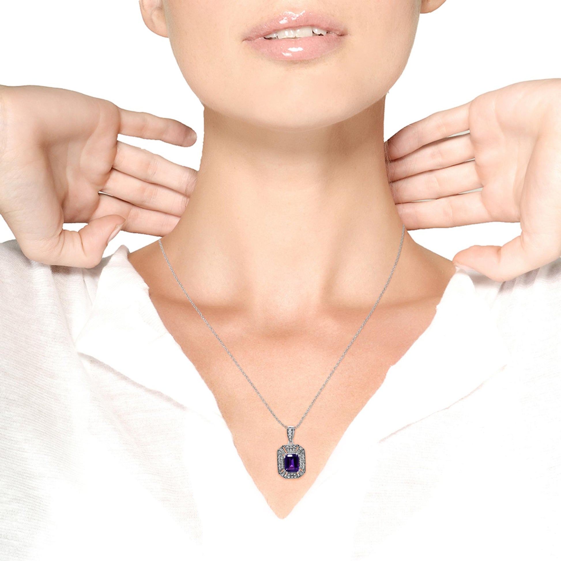 White metal necklace on a model, featuring a rectangular purple gemstone in prong setting surrounded by white round gemstones in prong settings, shot from front angle.