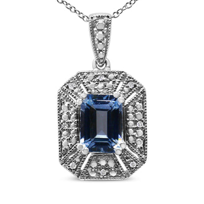 Front-facing shot of a white metal necklace pendant with a rectangular blue gemstone in the center, surrounded by round white gemstones in a prong setting.