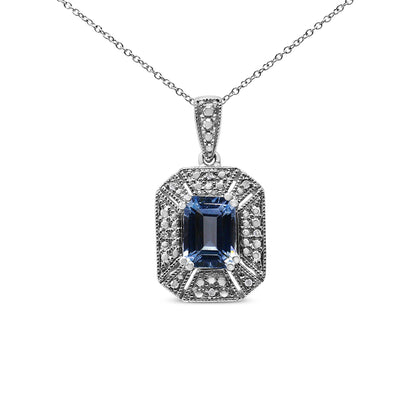 Front view of a white metal necklace with a rectangular blue gemstone pendant surrounded by small round white gemstones in prong settings.