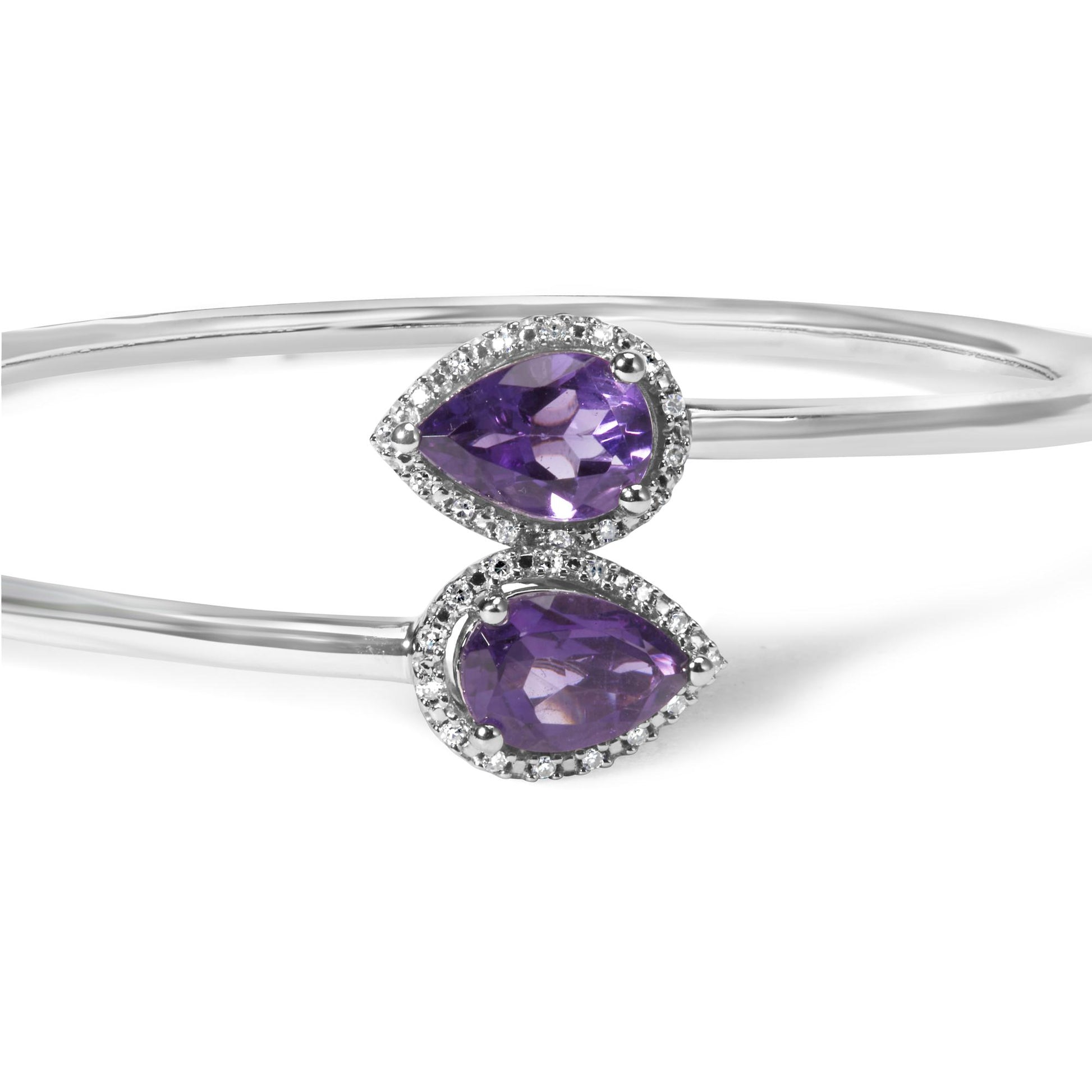 Close-up front angle of a white metal bracelet featuring two pear-shaped purple gemstones surrounded by small round white gemstones.