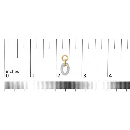 Close-up front view of a yellow metal earring with two linked oval shapes, the lower oval paved with white gemstones, shown on a scale.