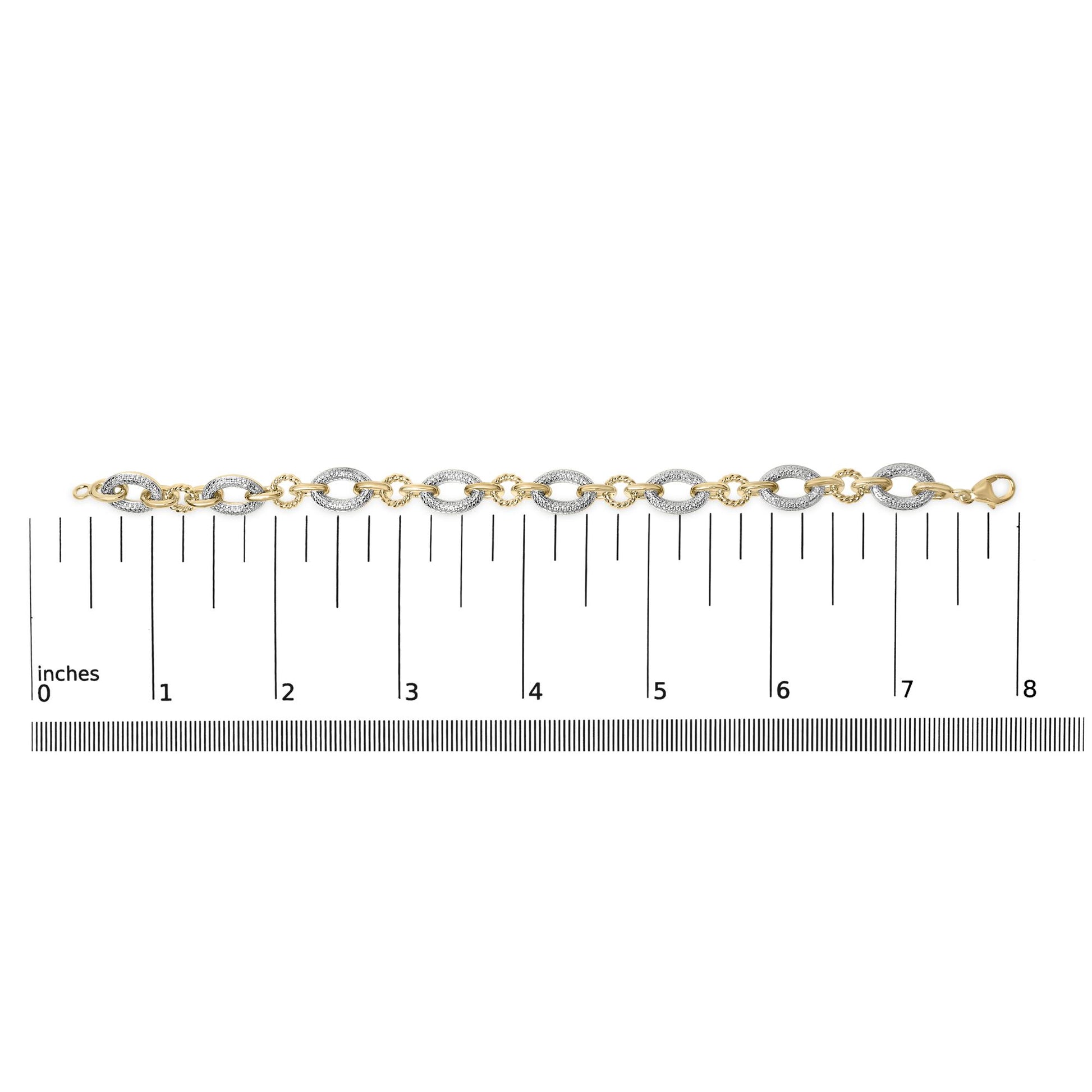 Bracelet shown flat on a scale from a top-down angle, featuring alternating oval-shaped links with pave-set white gemstones on some links and smooth yellow metal on others, with a clasp on one end.