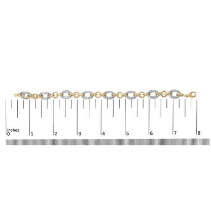 Bracelet shown flat on a scale from a top-down angle, featuring alternating oval-shaped links with pave-set white gemstones on some links and smooth yellow metal on others, with a clasp on one end.