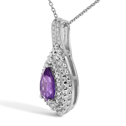 Close-up front angled view of a white necklace pendant featuring a pear-shaped purple gemstone surrounded by small round white gemstones in a pave setting.