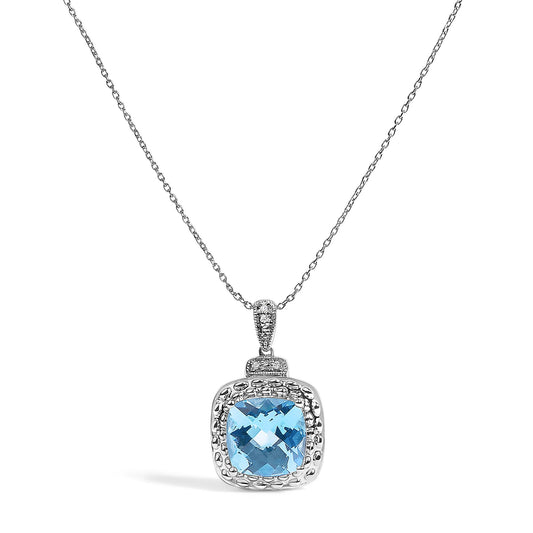 White metal necklace shown on a white background from a front angle, featuring a cushion-shaped blue gemstone pendant surrounded by small round white gemstones in a pave setting.