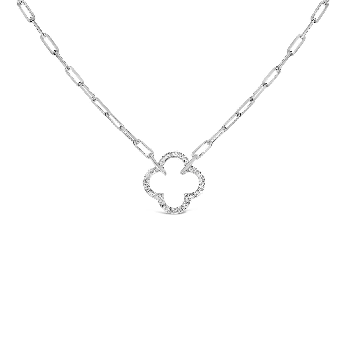 Close-up front angle of a white metal necklace with an openwork quatrefoil pendant pavé set with small white gemstones, shown on a white background.