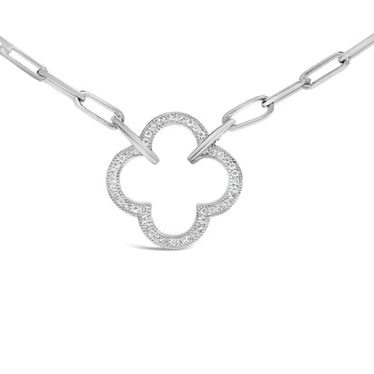 Close-up front view of a white necklace with a clover-shaped pendant featuring pave-set round white gemstones and elongated chain links.
