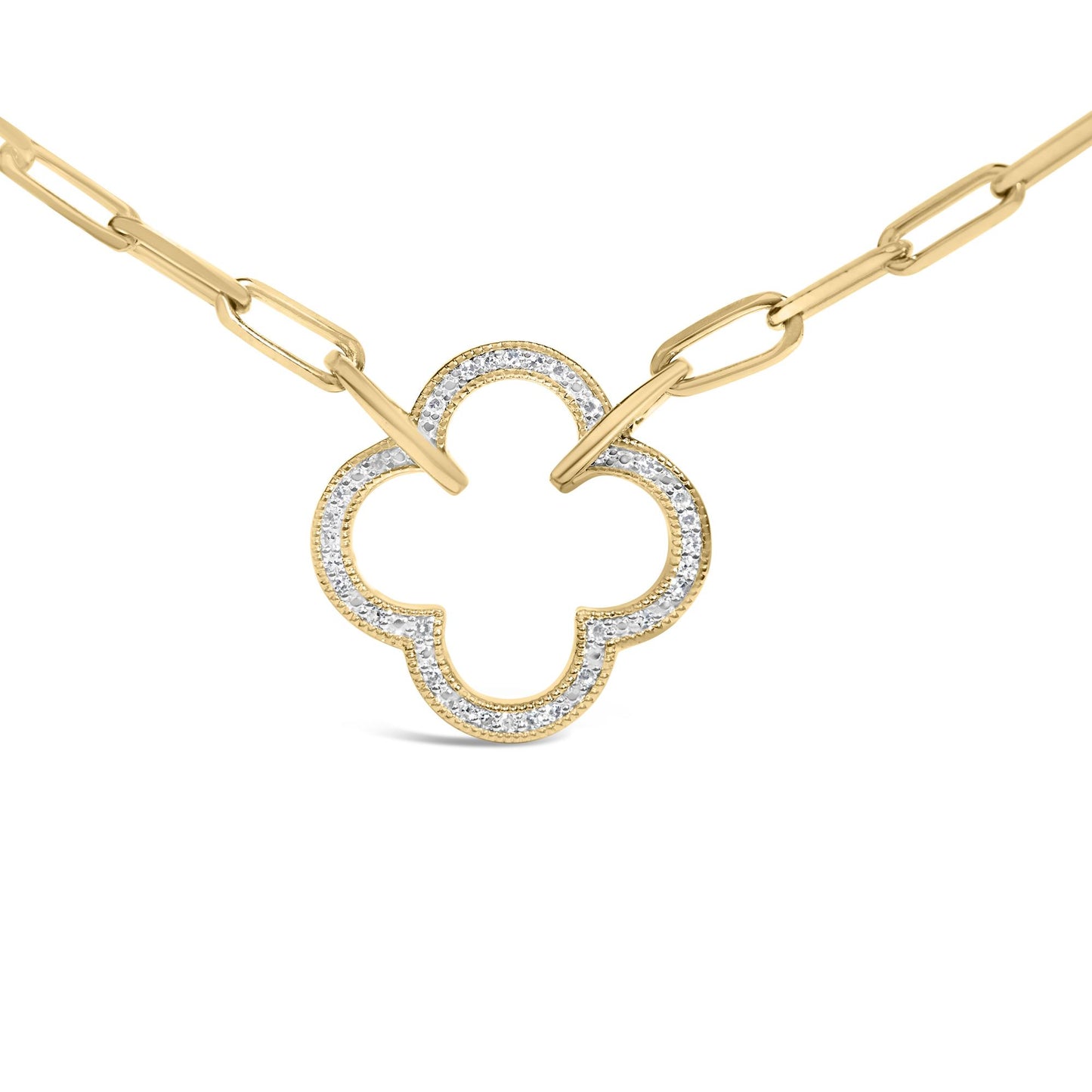 Close-up front view of a yellow metal necklace with a chain link and a clover-shaped pendant outlined with white gemstones in pave setting.