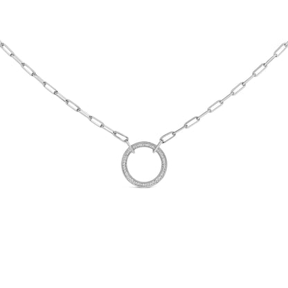 Close-up front view of a white metal necklace with a circular pendant featuring pave set round white gemstones, shown on a white background.