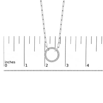 Close-up front view of a white necklace with a circular pendant featuring pave-set white round gemstones, shown on a measurement scale.