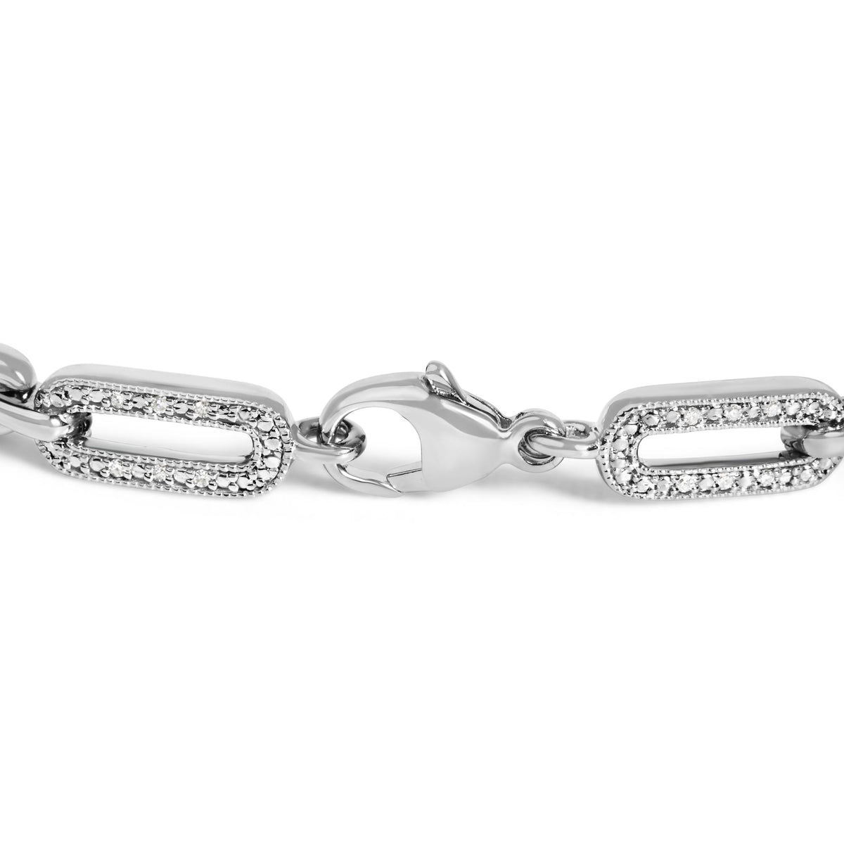 Close-up view of a white metal bracelet link with rectangular shapes featuring round white gemstones in a pave setting, showing the clasp at the center.