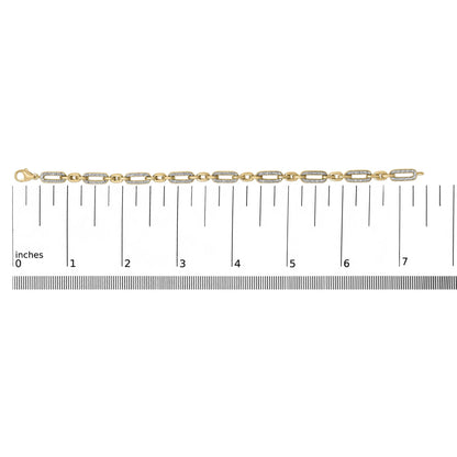 Yellow bracelet with alternating rectangular links, some paved with small white gemstones, shown on a ruler scale, top view.