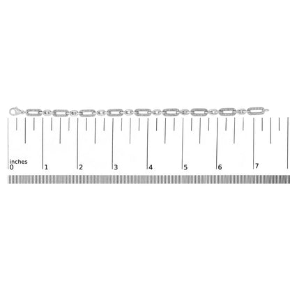 White metal bracelet with rectangular links featuring pave-set white round gemstones, displayed flat on a measuring scale, shown from a top-down angle.