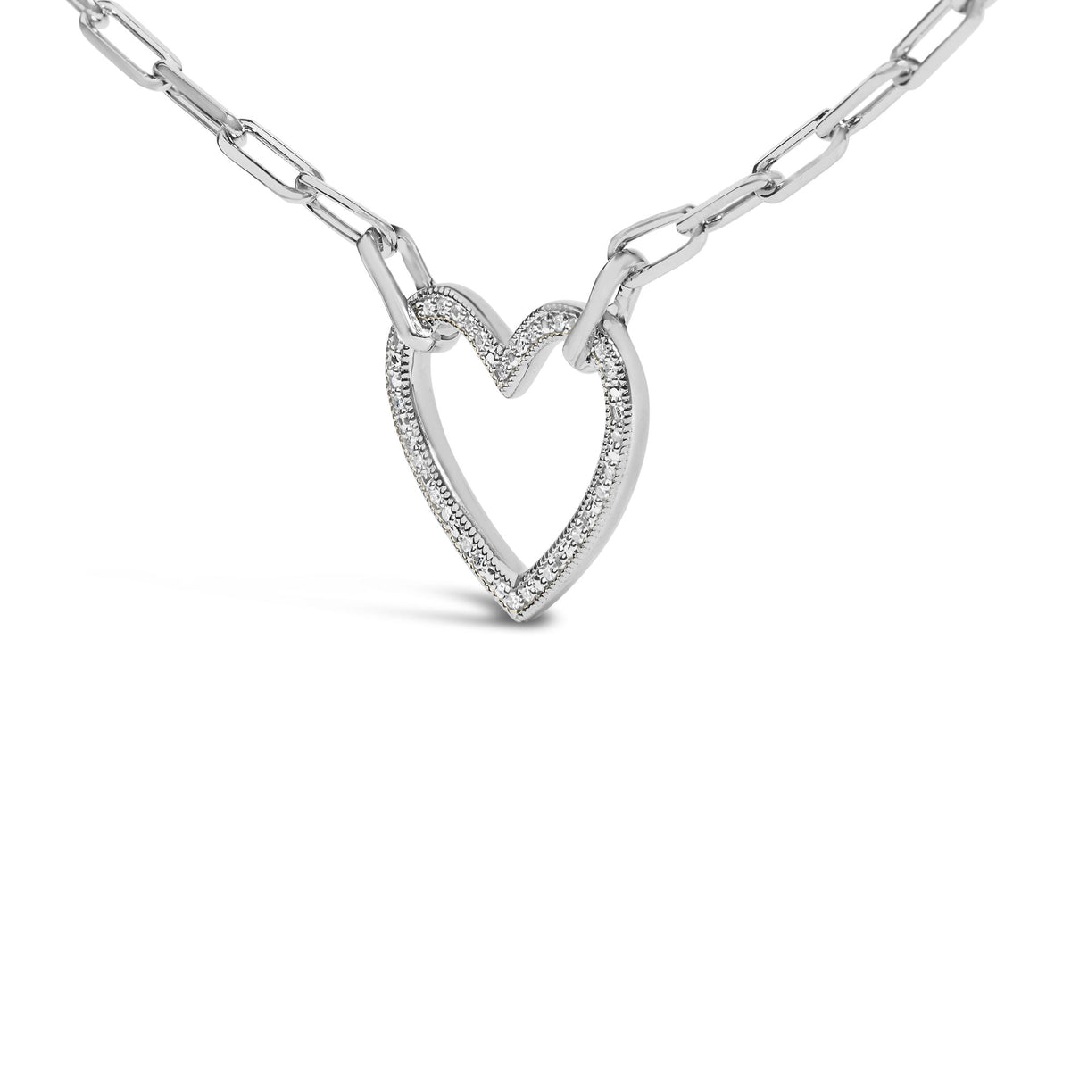 Close-up angled view of a white metal necklace chain with an open heart-shaped pendant featuring a pave setting of small round white gemstones.