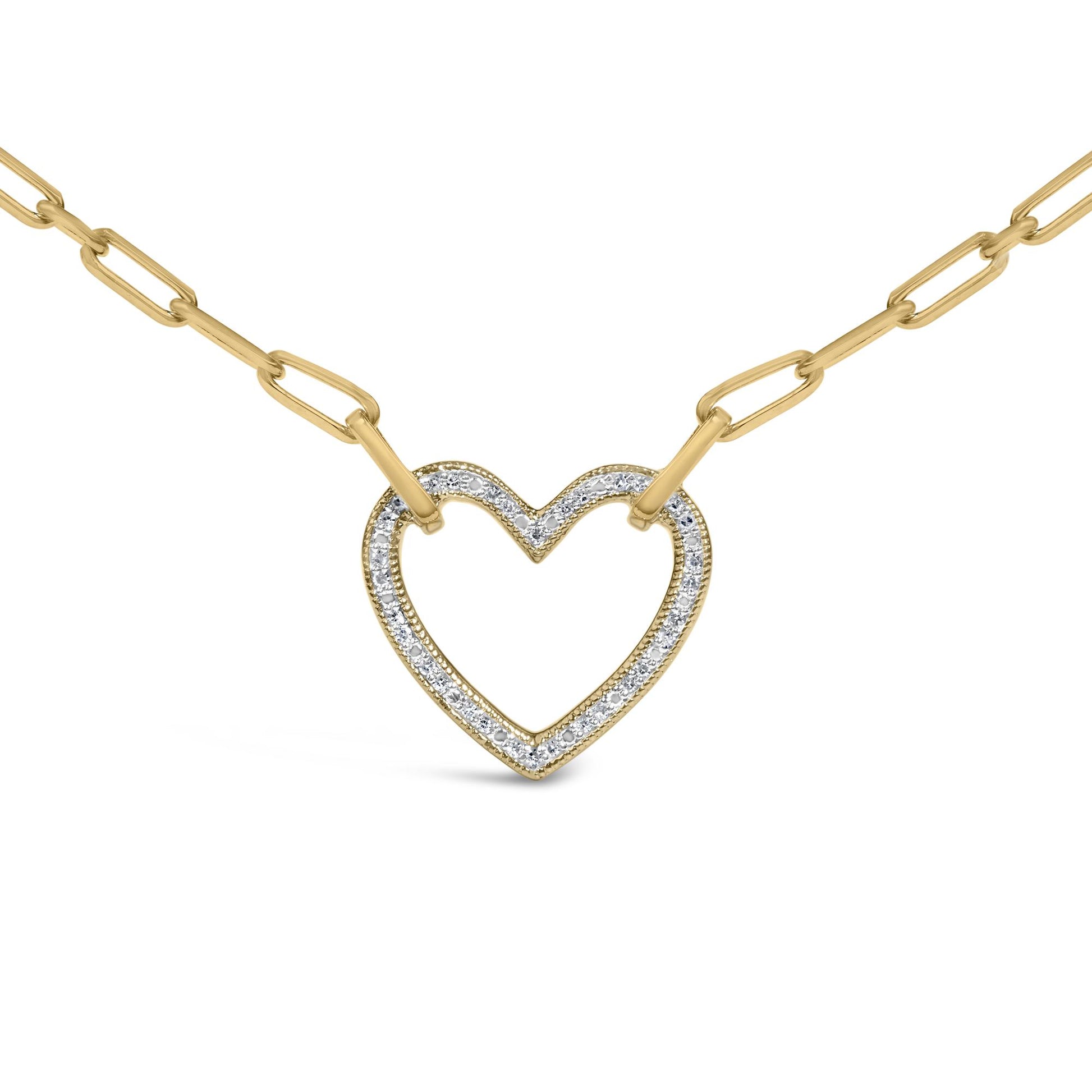 Close-up front angle of a yellow metal necklace with a heart-shaped pendant outlined with pave-set white gemstones, shown on a plain white background.
