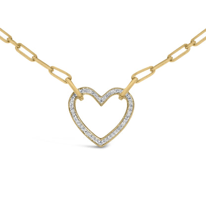 Close-up front angle of a yellow metal necklace with a heart-shaped pendant outlined with pave-set white gemstones, shown on a plain white background.