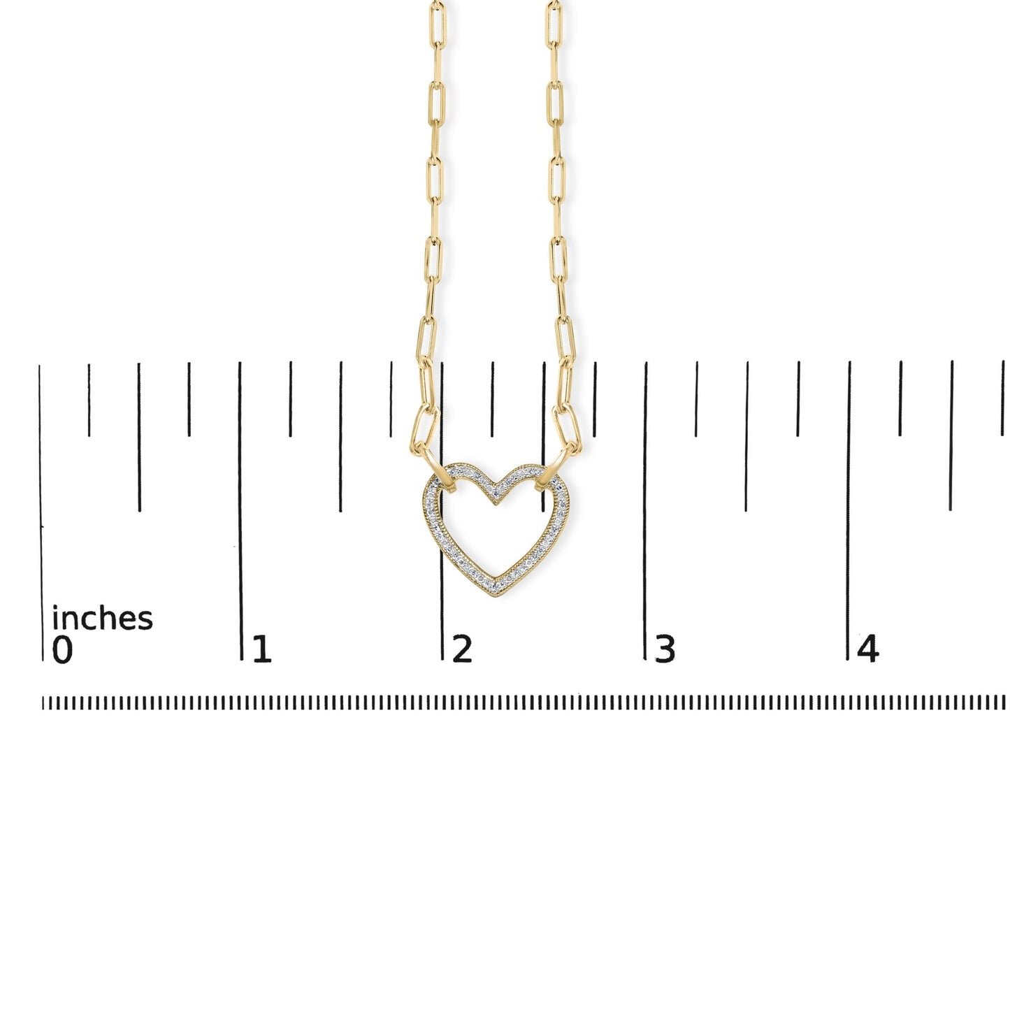 Close-up front view of a yellow necklace with a heart-shaped pendant featuring pave-set white gemstones, shown on a scale.