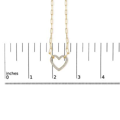 Close-up front view of a yellow necklace with a heart-shaped pendant featuring pave-set white gemstones, shown on a scale.