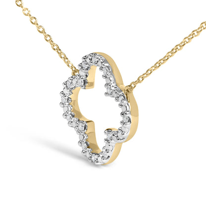 Close-up, angled view of a yellow metal necklace pendant in a heart shape accented with round white gemstones in prong settings along the outer edge, shown on a white background.