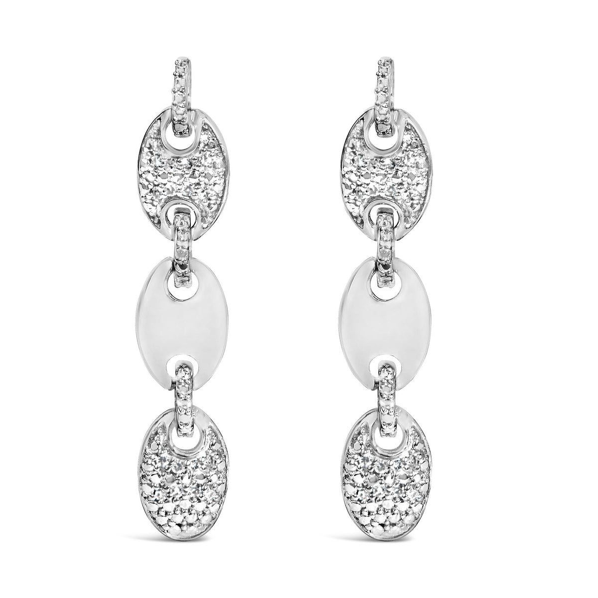 Close-up front view of a pair of white metal oval-shaped drop earrings with round white gemstones in pave setting on the top and connector links.