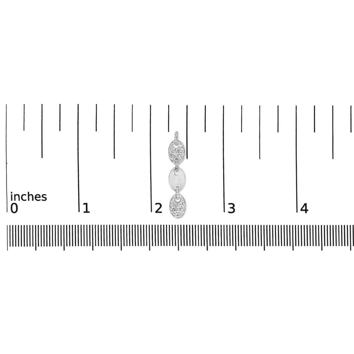 Close-up front view of white metal earrings with linked oval shapes, some pavé set with small white gemstones, shown on a ruler scale.