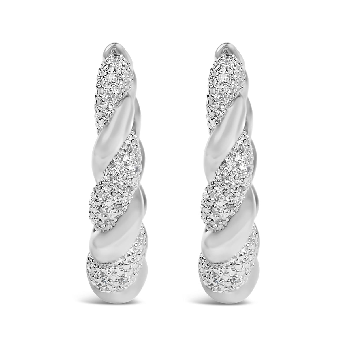 Close-up front view of a pair of white metal earrings with a twisted design featuring pave-set round white gemstones.