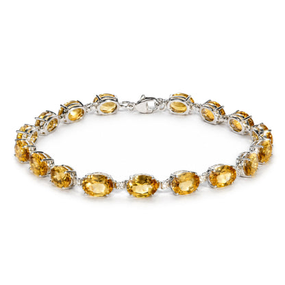 Close-up front angle of a white metal bracelet featuring oval yellow gemstones and small round white gemstones in prong settings, shown flat on a white background.