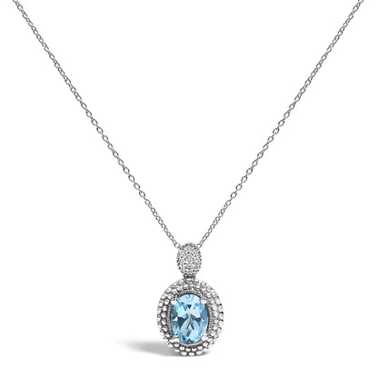 White metal necklace with a pendant featuring an oval-shaped blue gemstone surrounded by a halo of small white gemstones in a pave setting, shown in a front-facing view.