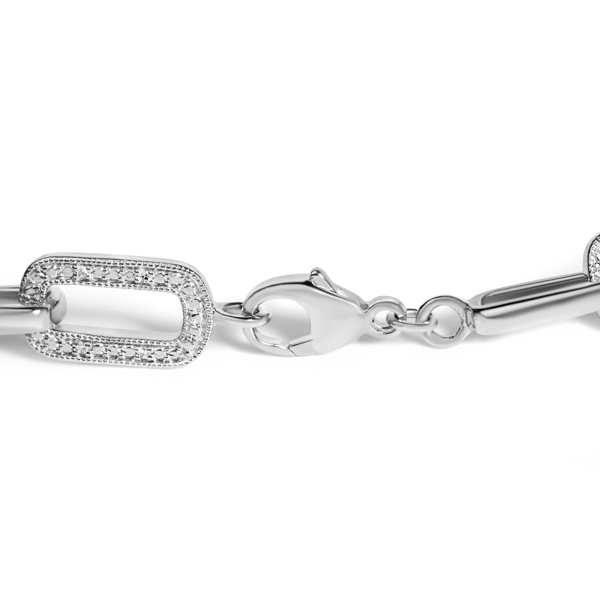 Close-up front angle of a white metal bracelet segment with rectangular links featuring round white gemstones set in a pave setting, shown on a white background.