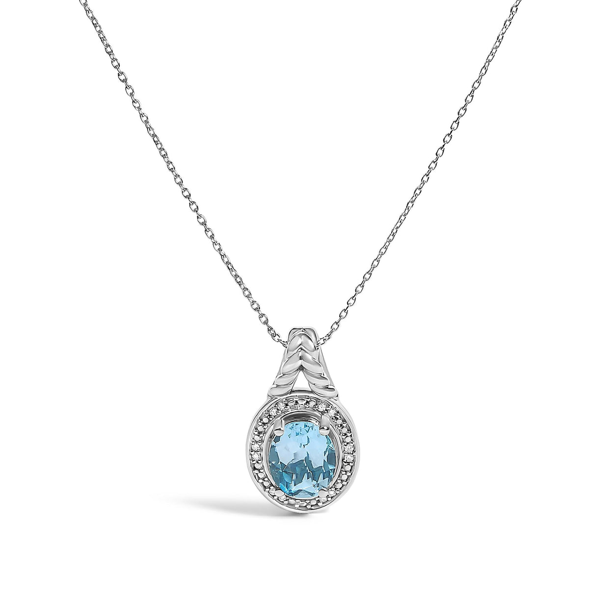 Close-up front view of a white metal necklace pendant with an oval blue gemstone surrounded by round white gemstones in a prong setting, shown on a white background.