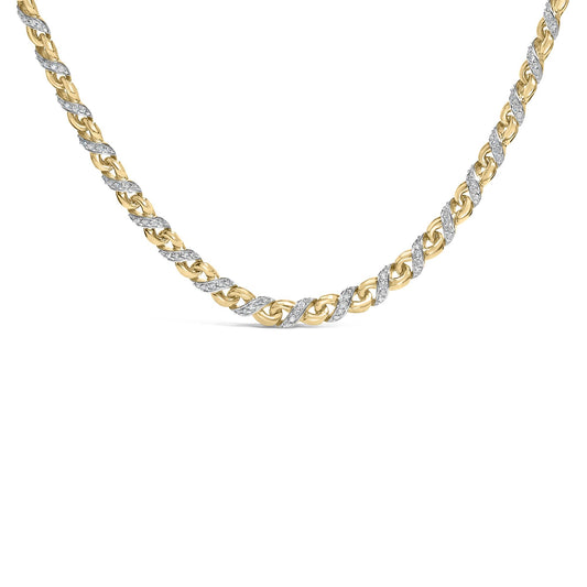 Close-up front view of a yellow metal necklace with intertwined links, some adorned with white round gemstones in prong settings.