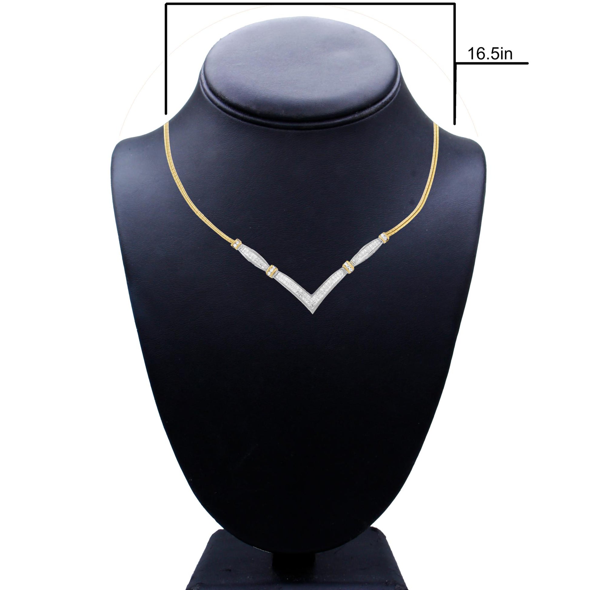Front view of a necklace on a black bust display featuring a V-shaped white gemstone design inlaid with round and princess shaped white gemstones, set on a dual-colored metal chain in yellow and white.