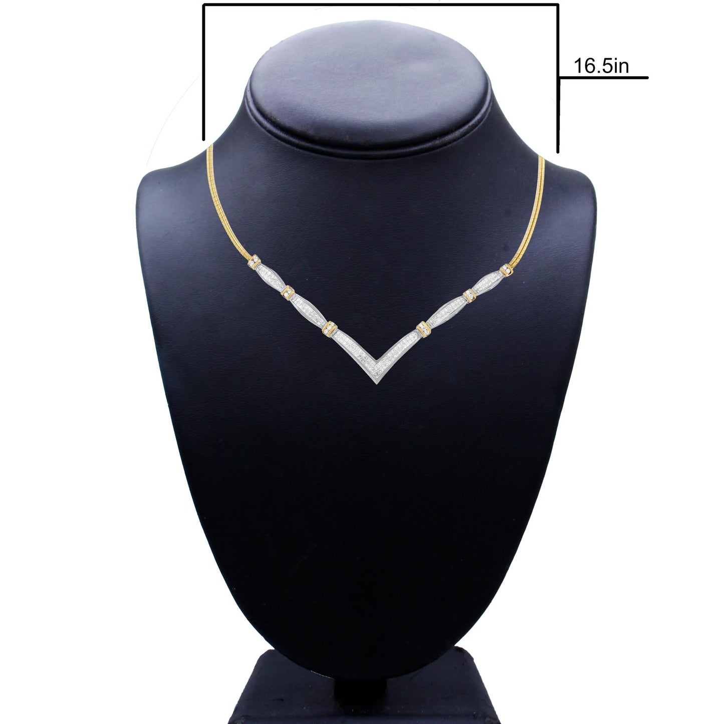 Front view of a yellow and white necklace on a black display bust, featuring a V-shaped design with sections set with white round and princess shape gemstones.